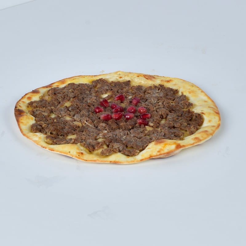 Meat manakish with pomegranate molasses